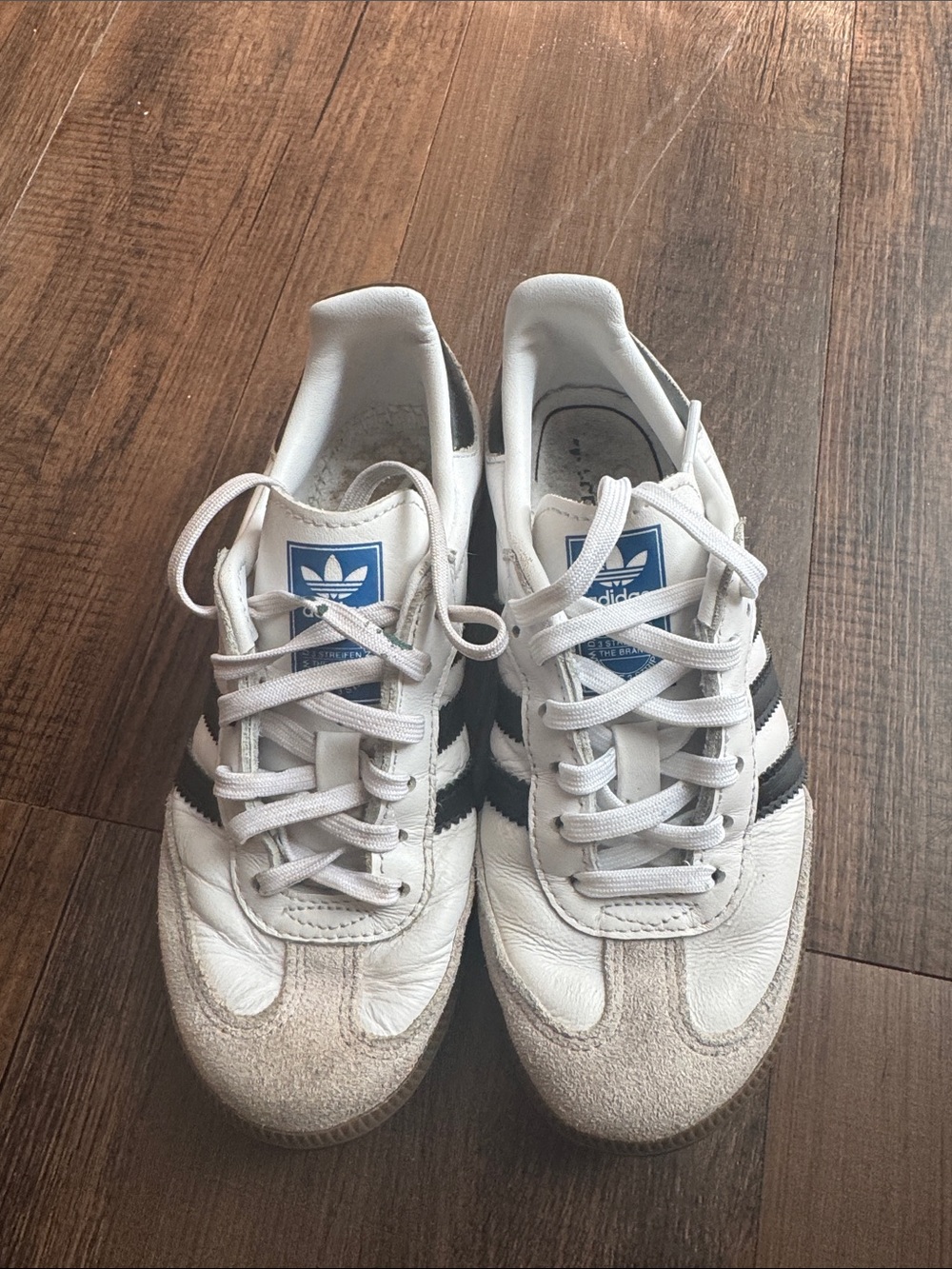 adidas White Sneakers with Black Stripes and Blue Tongue Logo